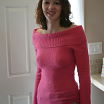 В розовом свитере :)